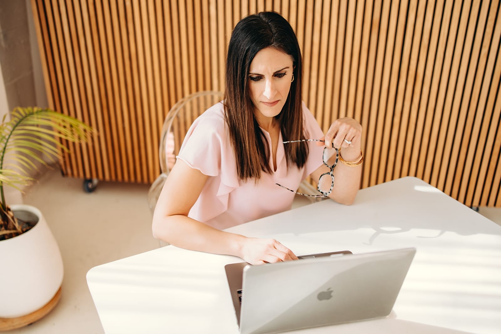 Nicole Runyon reviewing notes at her laptop