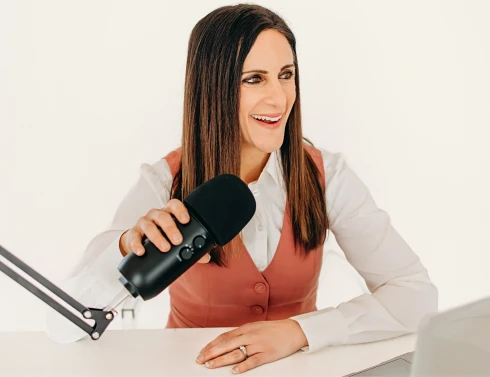 Nicole Runyon recording a podcast